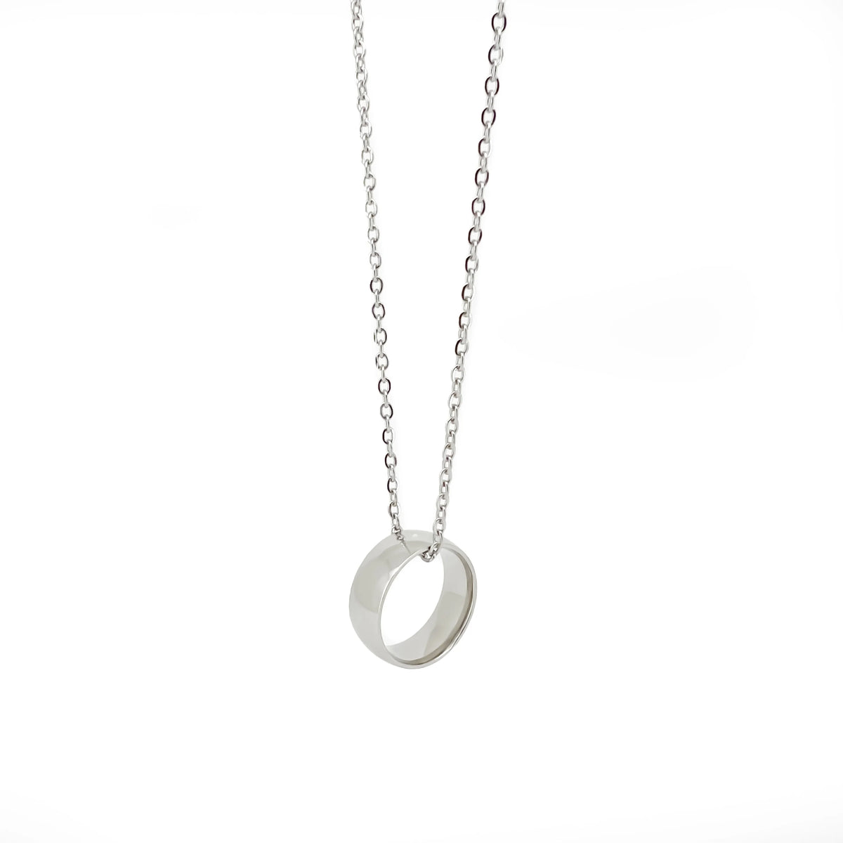 Silver pendant necklace with a circular ring charm.