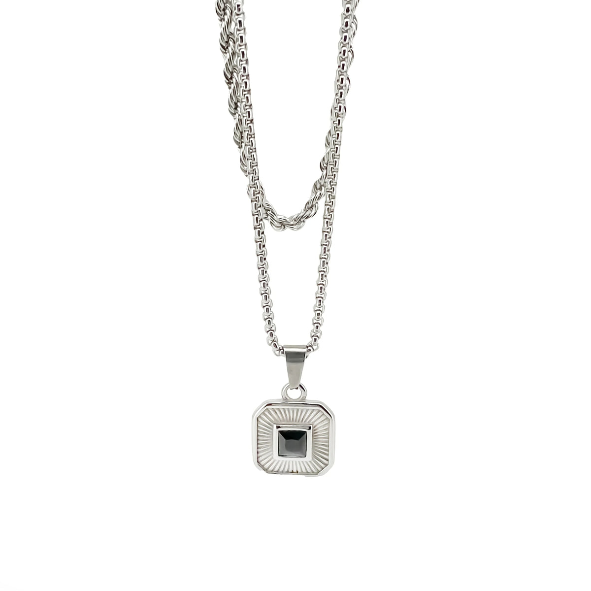 Silver pendant necklace with a square-shaped charm featuring a black center stone.