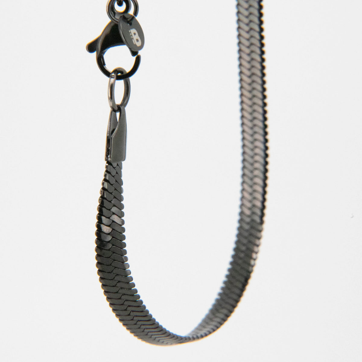 Metal snake chain with a clasp attachment.