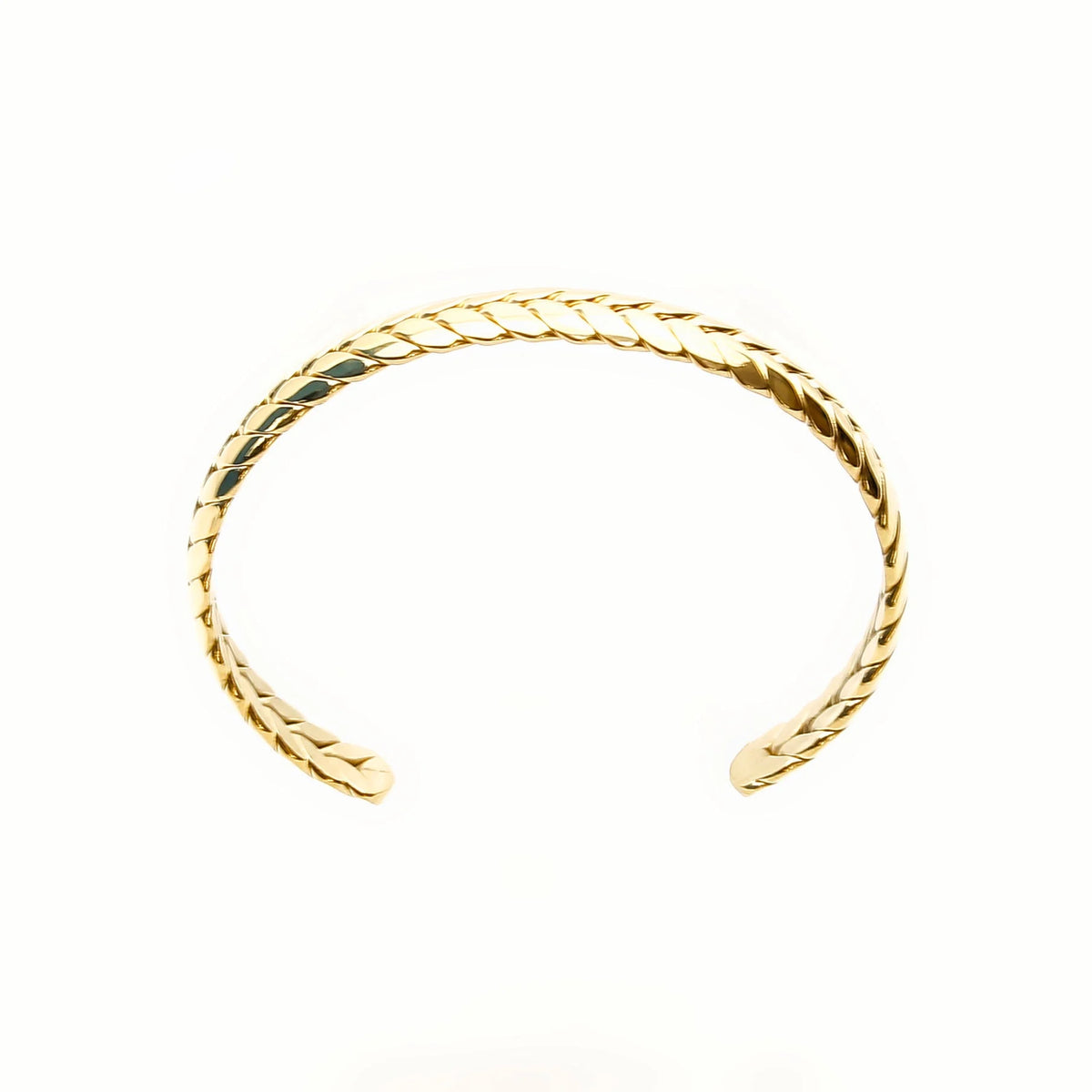 Gold twisted cuff bracelet with an open design.