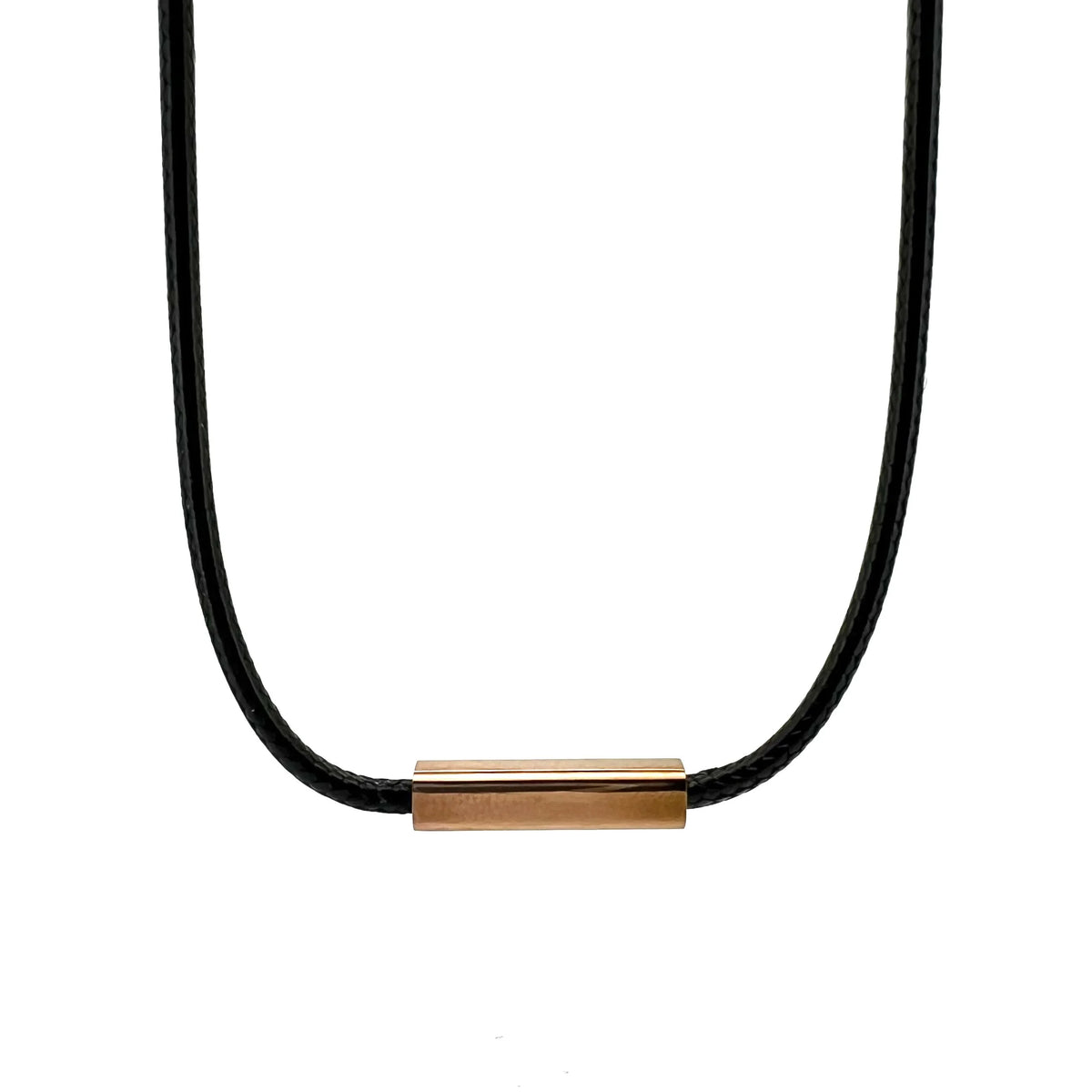 Black cord necklace with a gold-colored rectangular pendant.