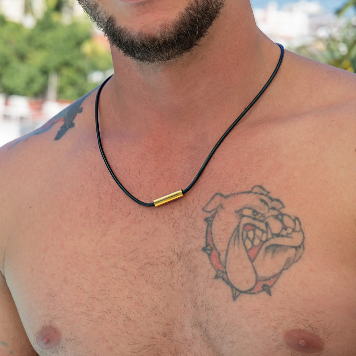 Tattoo of a bulldog’s face on a person’s chest.