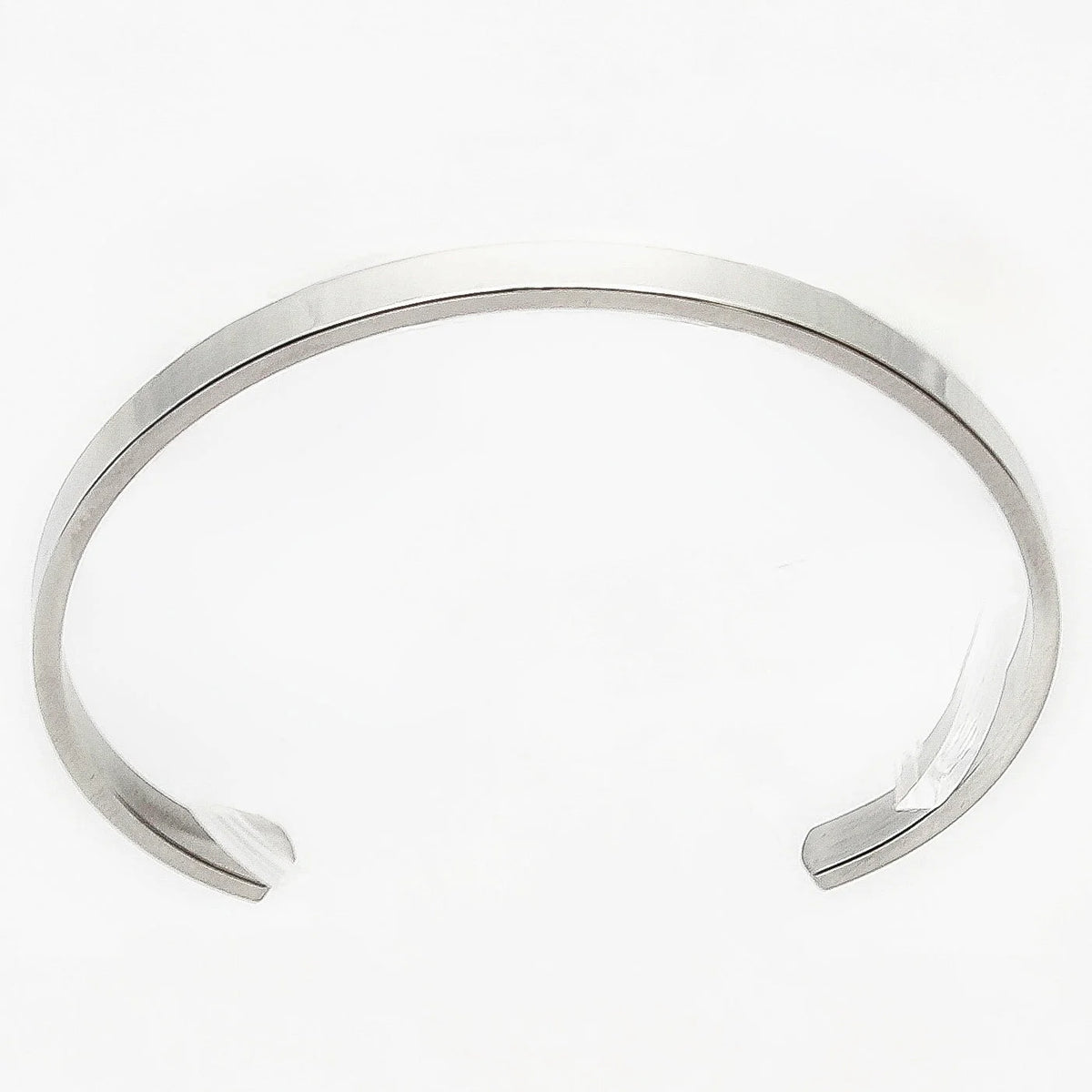 Simple silver metal cuff bracelet with open ends.