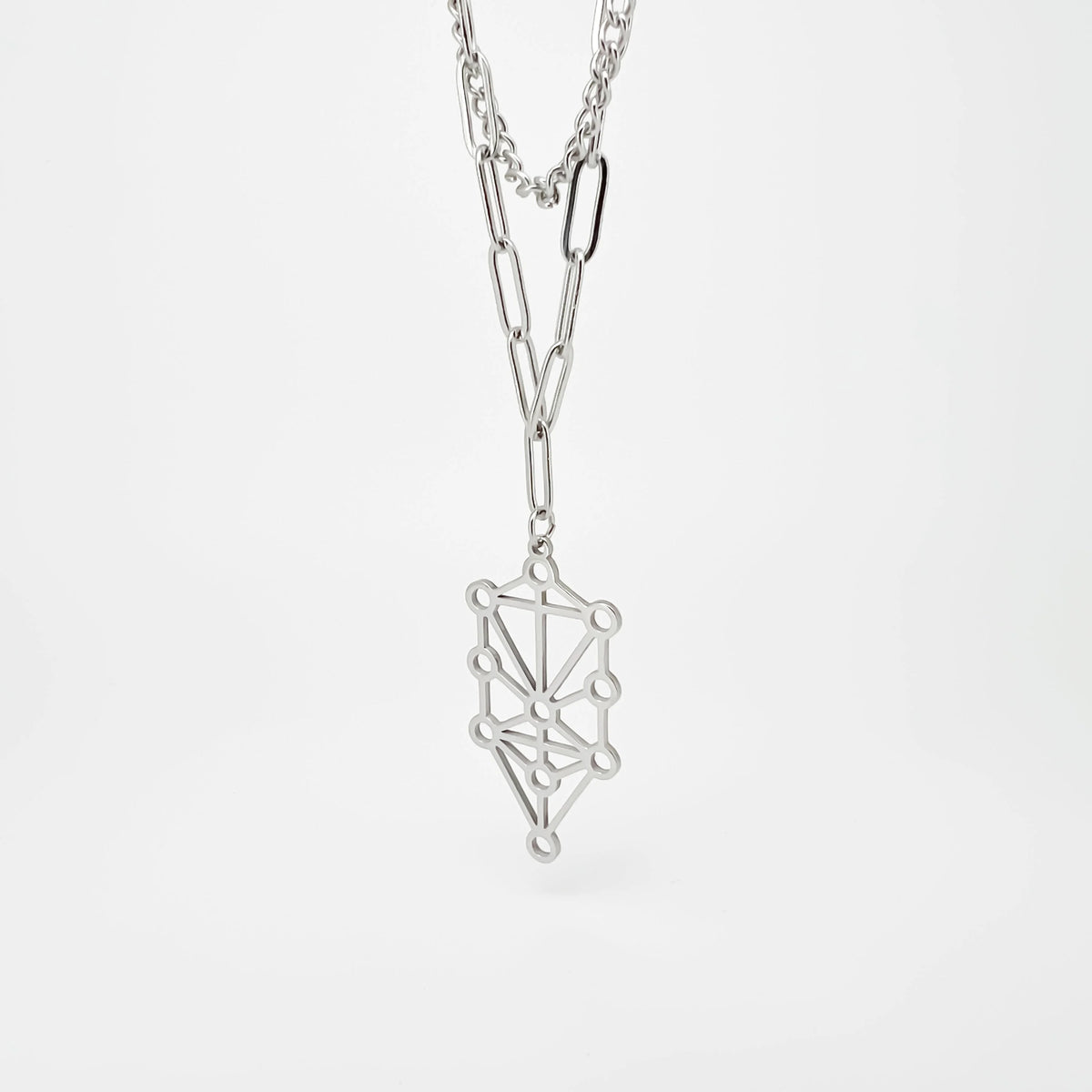 Silver necklace with a geometric pendant resembling an abstract network or constellation design.