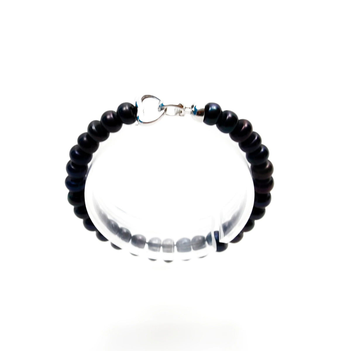 Beaded bracelet with black and clear beads and a silver clasp.