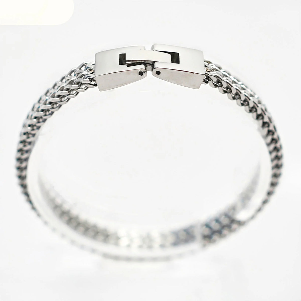 Silver chain bracelet with a rectangular clasp.